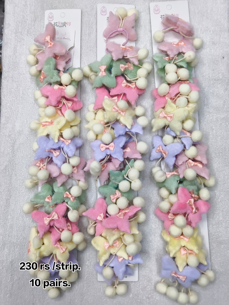 Cute butterfly hair ties with pom pom hangings